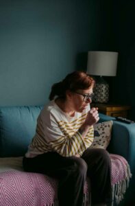 Coughing woman with long-covid syndrome