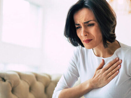 Woman with chest pain due to heart disease