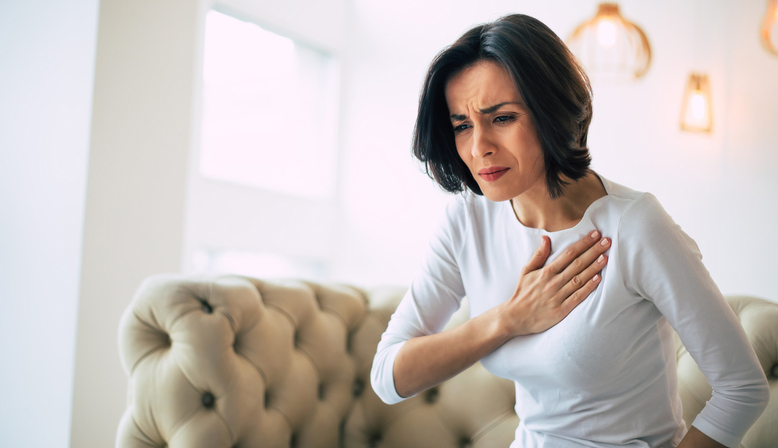 Woman with chest pain due to heart disease